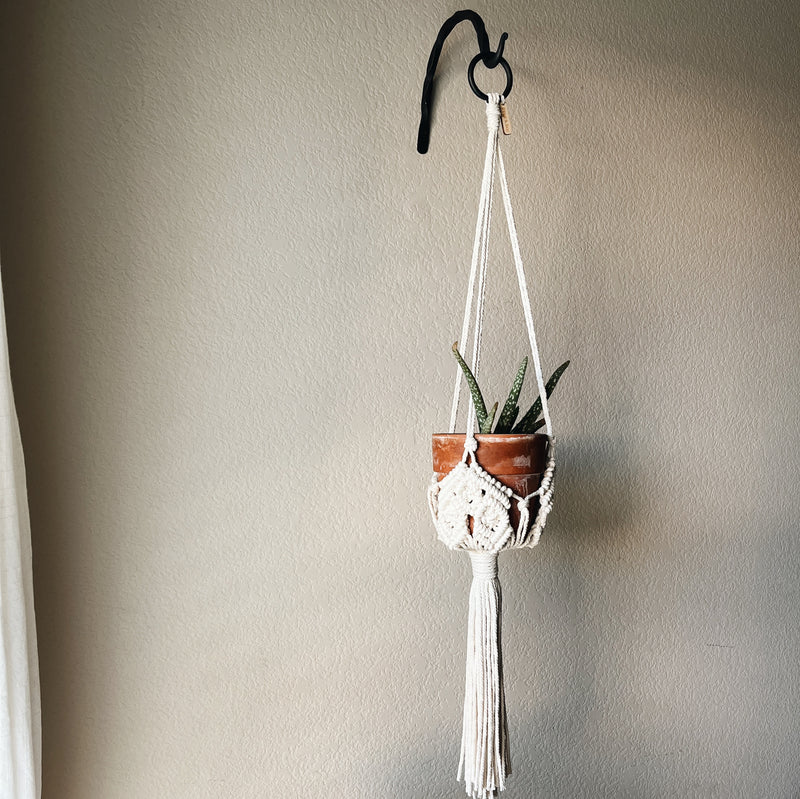 bohemian hanging planter full length view with a black steel ring at the top