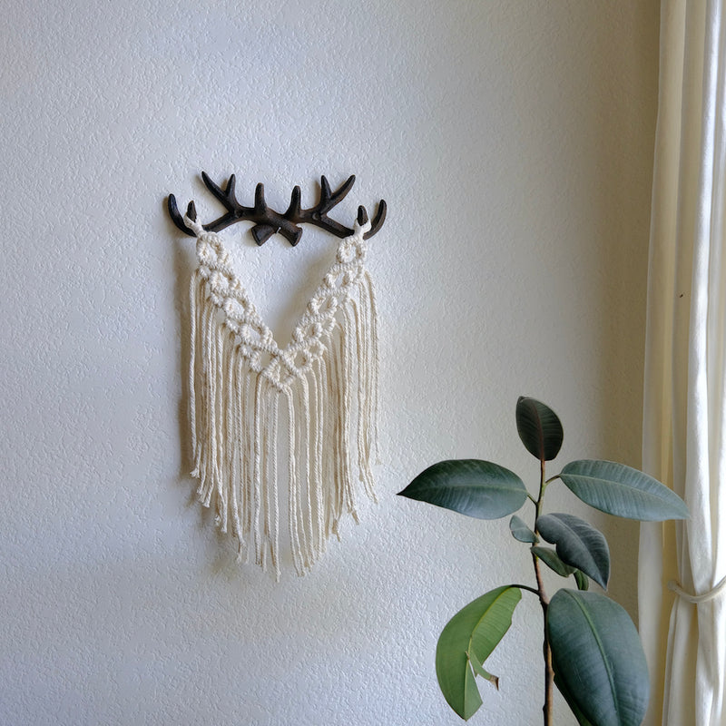 antler home decor, macrame wall hanging made off of metal antler wall hook