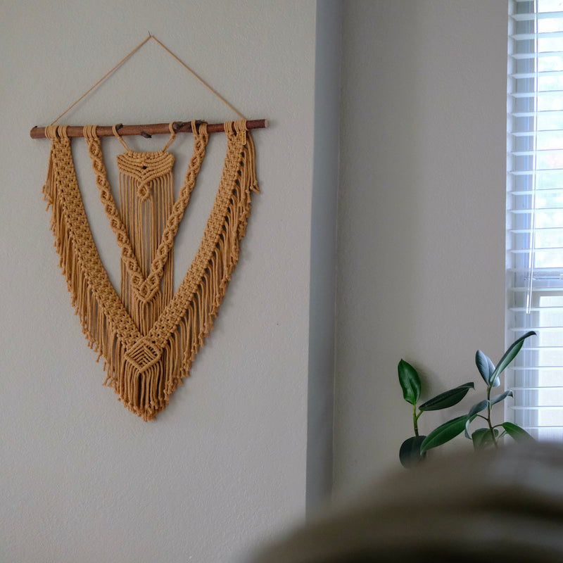 Macrame fiber art piece designed to enhance interior decor with a blend of modern and traditional knotting techniques