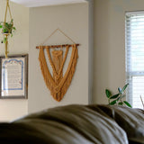 Chic macrame fiber art wall hanging featuring detailed knot patterns and soft, natural cotton yarns