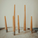 Set of 6 inch and 10 inch hand-poured honey beeswax taper candles displayed together, unlit