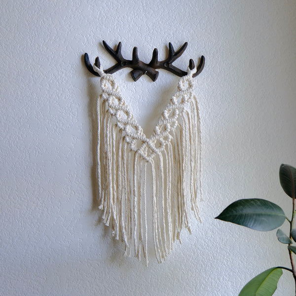 antler home decor, white cotton macrame wall hanging hand off of metal antler wall hook base