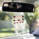 car oil diffuser hanging from mirror