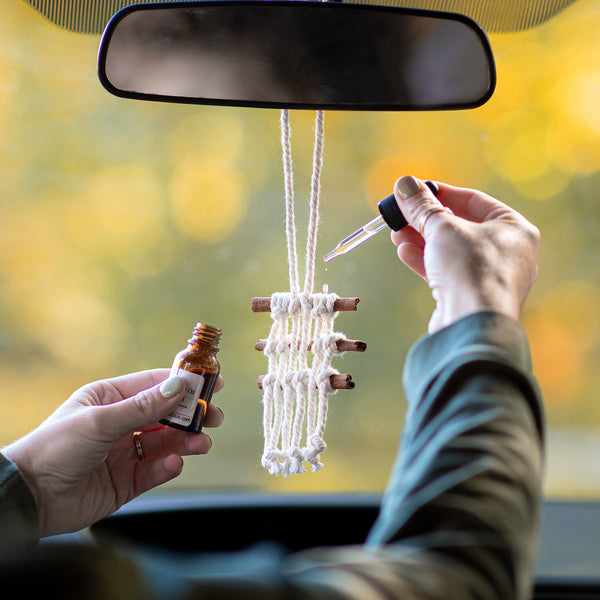 essential oil dropped onto diffuser in car
