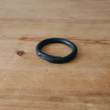 one macrame ring, showing the overlap edge where the blacksmith forged the ring