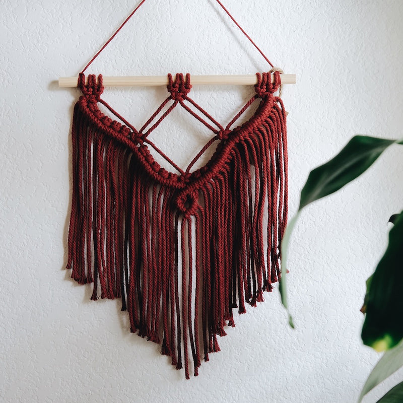 Quade wall hanging in Chinaberry, a deep cherry color